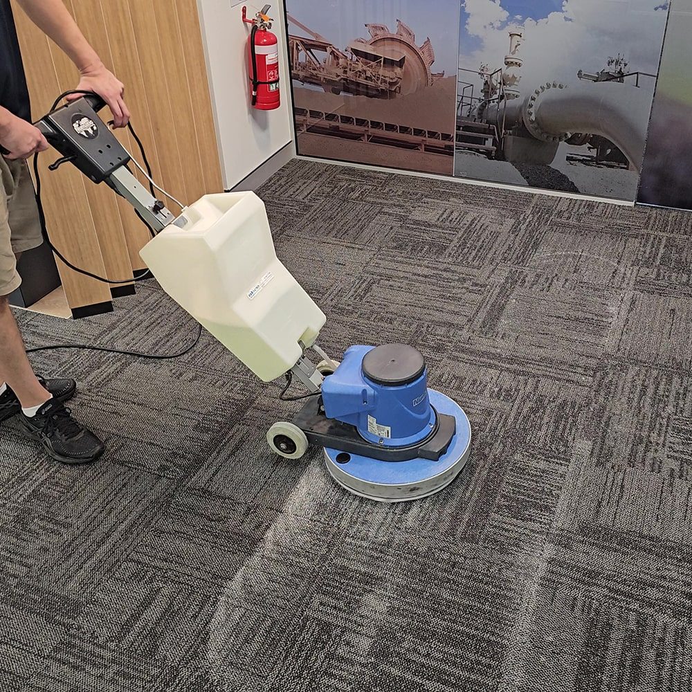 Low moisture carpet cleaning across office carpet tiles in Perth, the commercial carpet cleaning card.